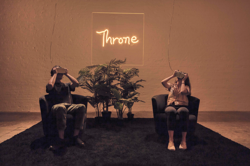   Throne,  2019 LED, Plexiglas, silicone, velvet chairs, plastic plants and HD virtual reality color video with sound. 
