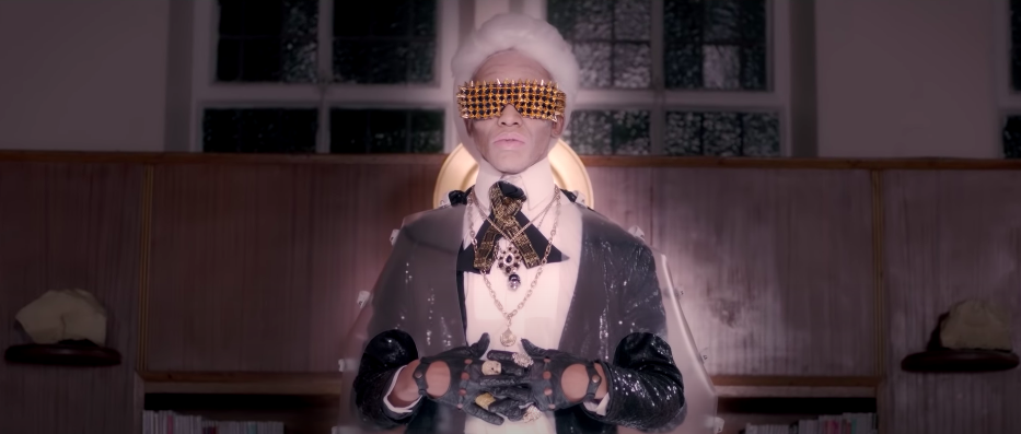 Umlilo as Karl Lagerfeld in ‘Chain Gang’ (2014).